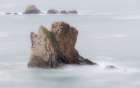 Spain. Ocean sea stack on misty coastline. Art Print